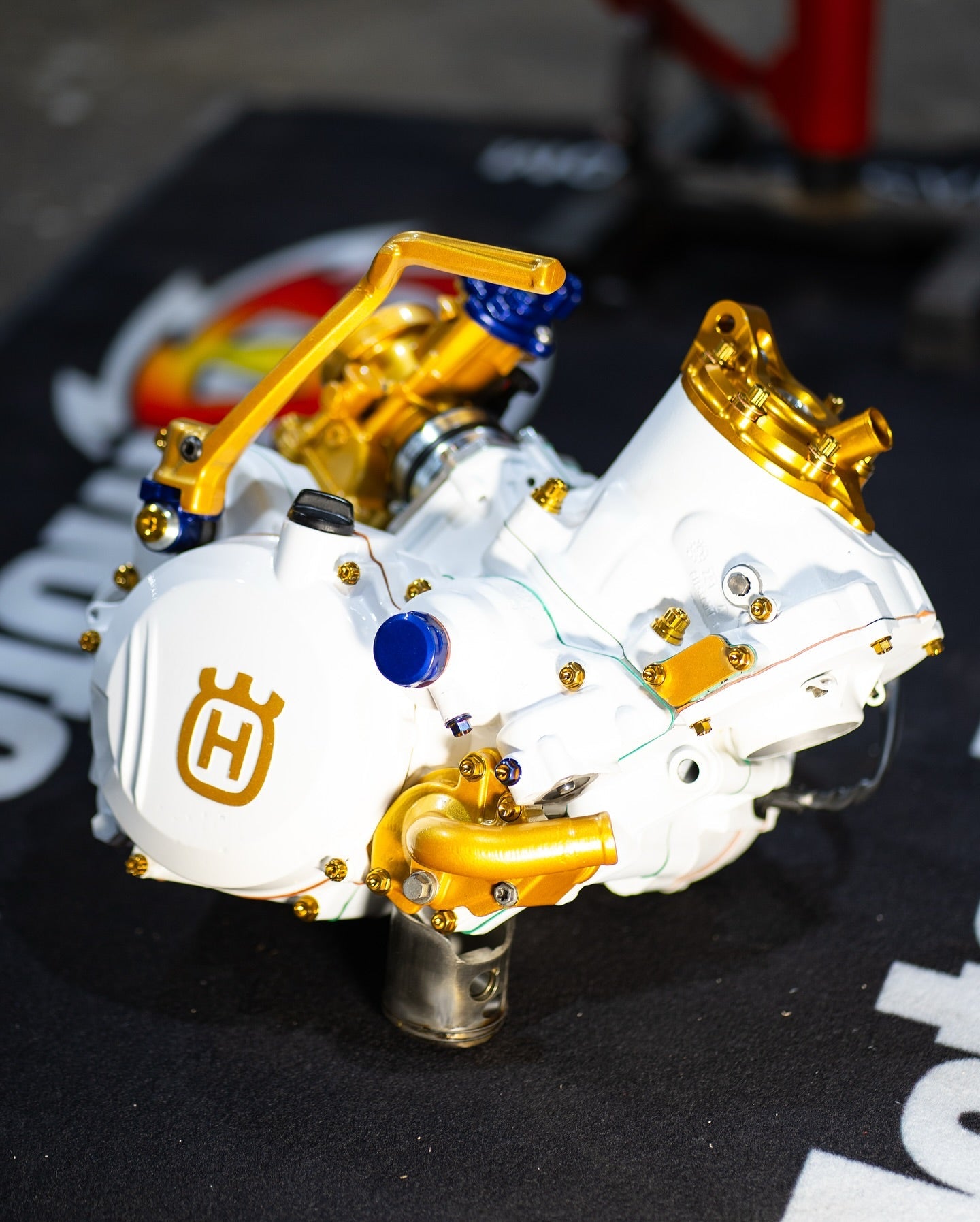 Why are titanium alloys the "gold standard" for motorcycle fasteners?